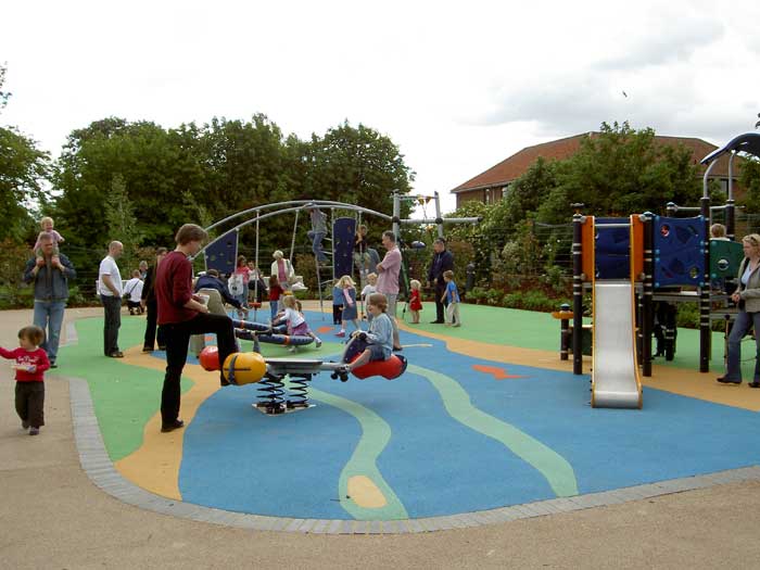 The playground, facing the trees along the river